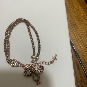 PREMIER DESIGNS bronze Tone Hostess
Charm Bracelet